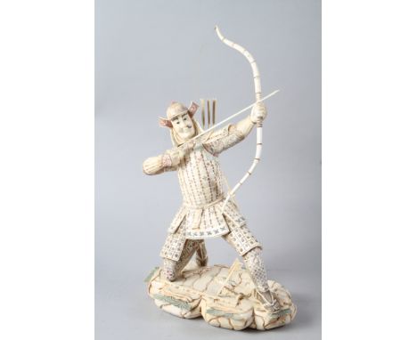 A carved sectional bone figure of a kneeling Samurai archer, 12" high, and a figure of a farmer smoking a pipe, 8"high 