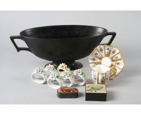 A Wedgwood Ravenstone black glazed two-handled planter, a Coalport shaped cabinet cup and saucer, decorated panels of birds, 