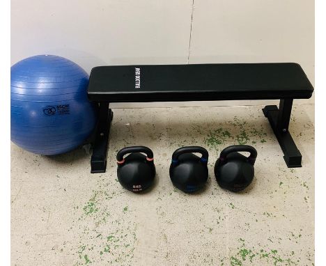 A Bulldog Gear bench and kettle drum set, along with an exercise ball.