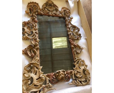 A Stripped Lime and Pine Mirror. A modern rectangular plate within an elaborate pierced foliate frame, the apron centred by a