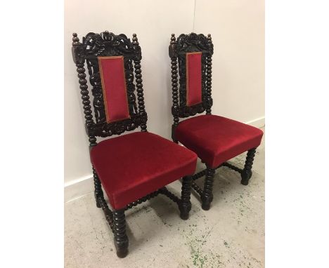 A Pair of Victorian chairs with scroll carved sides on bobbin turned legs.
