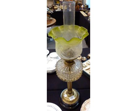 BRASS PARAFFIN LAMP. Brass and glass paraffin lamp with green engraved shade