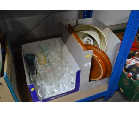 Two boxes containing various drinking glasses, lamp shades, plates etc.
