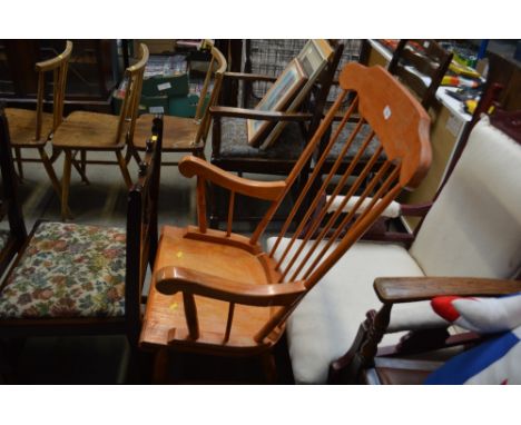 A beech stick back rocking chair