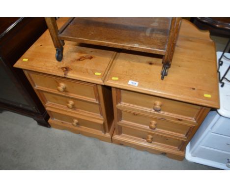 A pair of pine bedside chests fitted three drawers