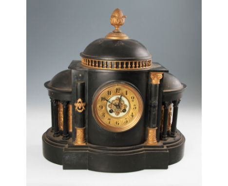 A 19th Century French slate mantel clock in the form of a building with two column to front with two rounded sections to ends
