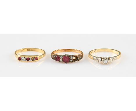 A lot to include three rings, one being a diamond solitaire, stamped 18ct, ring size M½, an 18ct yellow gold ruby and colourl