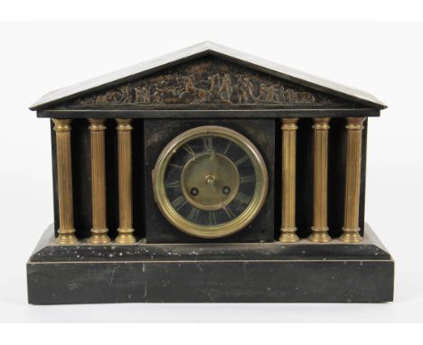 An early 20th Century American style black slate clock with column design with brass farming scene plaque to top, the dial ha