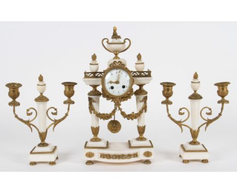 An early 20th Century French white marble and ormolu clock garniture, clock having column supports with shaped foot with fini