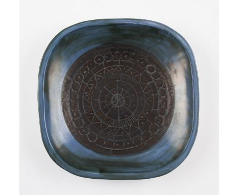 A Troika studio pottery D shaped plate having abstract design to centre all on blue glaze ground, marked to base Troika, St I