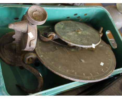 Two hanging weighing scales.
