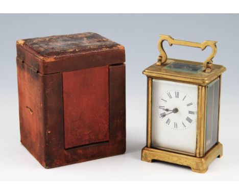 An early 20th Century brass carriage clock, having white enamel dial with black Roman numeral hourly markers with minute trac