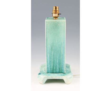 A Ruskin pottery lamp base with rectangular body on rounded square footed base, both having light green crystalline glaze, ma