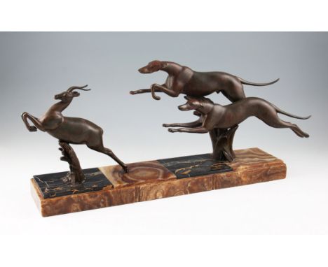 An Art Deco bronze sculpture signed Rochard, depicting two greyhounds chasing a gazelle, mounted on marble plinth with altern