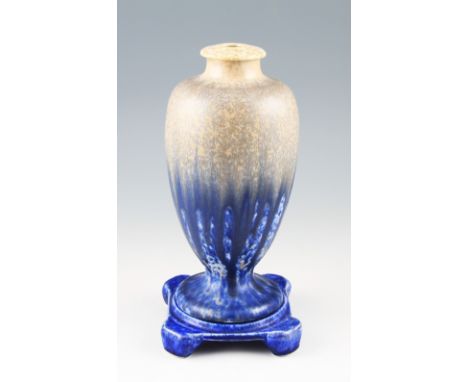 A Ruskin Pottery lamp base of baluster form having cream, beige and blue crystalline glaze, marked to base Ruskin England 192