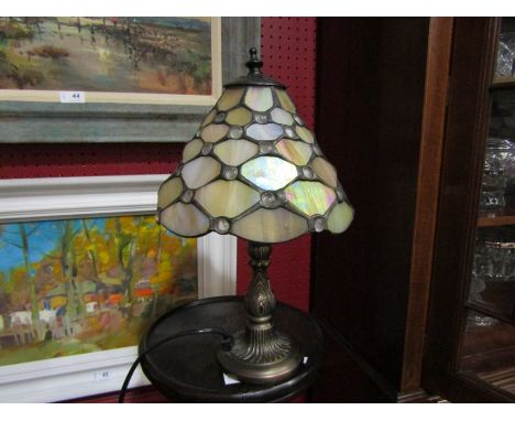 A Tiffany style table lamp with lead glass shade, 34cm tall