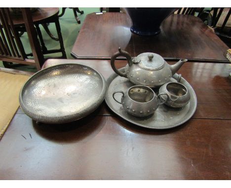 A selection of pewter wares to include a charger, teapot, footed bowl and jugs (5)