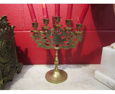 A brass five sconce candlestick with dragon detail, Stamped made in China 