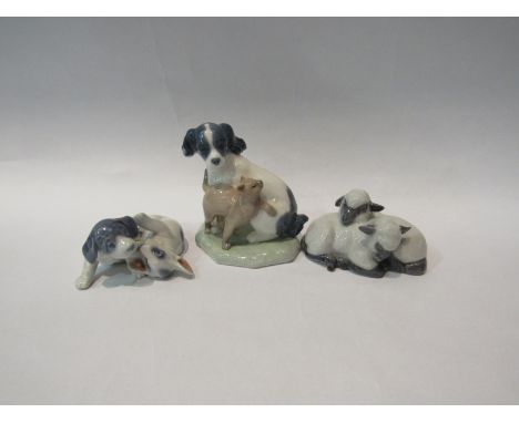 Two Royal Copenhagen figural groups, playful puppies and sleeping lambs and a Nao figural group of dog and cat 