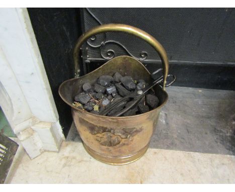 A wrought iron fire screen a brass example and a brass coal bucket (3)