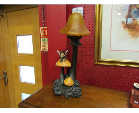 A figural lamp of a fairy and toadstools, 41cm tall