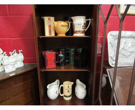 Eleven assorted ceramic whisky jugs including Jameson, Teacher's, Clan Campbell etc