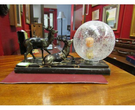 A French Art Deco table lamp with a pair of deer on a marble base 