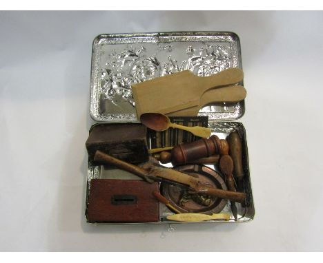 A lockable tin with bygone items including treen containers, tools, money boxes