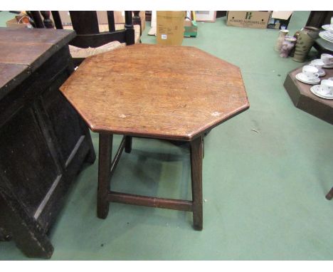 An early 19th Century oak octagonal top lamp table with pegged base, 54cm diameter