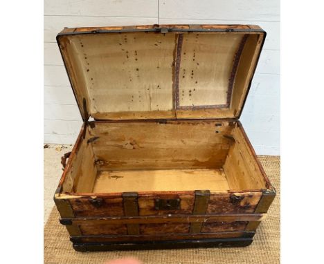 A vintage pine domed trunk. Banded and with black metal rivet fittings 84x46 height60