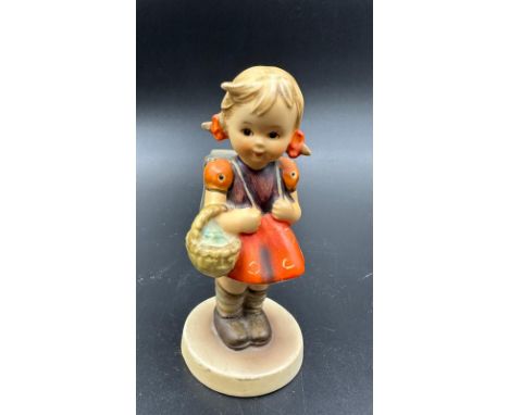 A West German Hummel Goebel figure of a school girl 