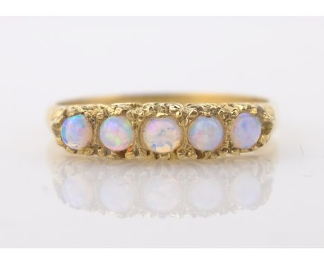 Gold five stone opal ring hallmarked 9ct   Condition Report  Approx 2gm  Click here for further images, condition, auction ti