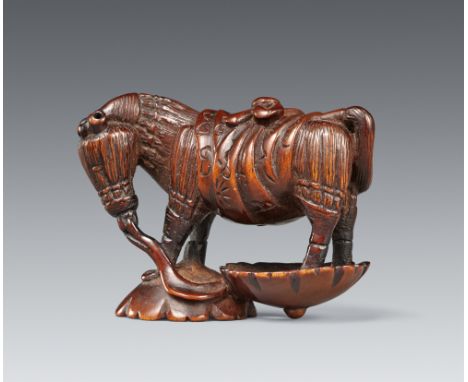 Netsuke eines Strohpferdes. Dunkelbraunes Holz. 19. Jh.Das Modell eines Strohpferdes besteht aus sechs Strohbesen, deren Stil