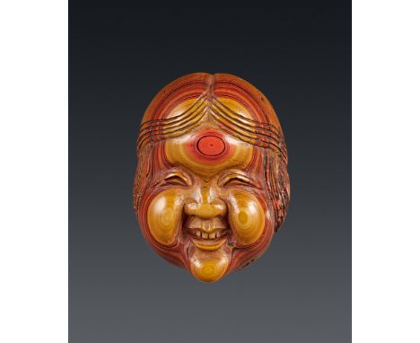 Masken-Netsuke der Okame. Lackblock. 19. Jh.Sign.: ShūzanMit typischem, freundlichem Gesichtsausdruck, gescheitelten Haaren u