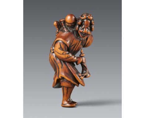 Netsuke eines Holländers mit Jungen. Buchsbaum. Spätes 18./frühes 19. Jh.Leicht vorgebeugt stehend, in der rechten Hand eine 