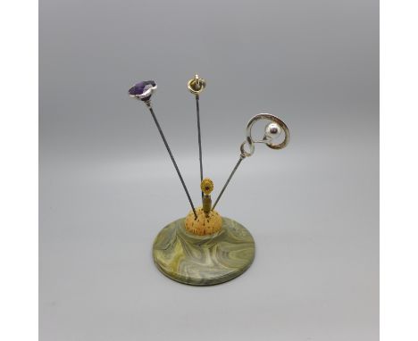 Two silver hat pins by Charles Horner, a 9ct gold hat pin and a 15ct gold stick pin with pin stand 