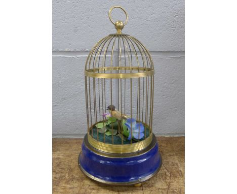 A modern bird model automaton in a brass cage 