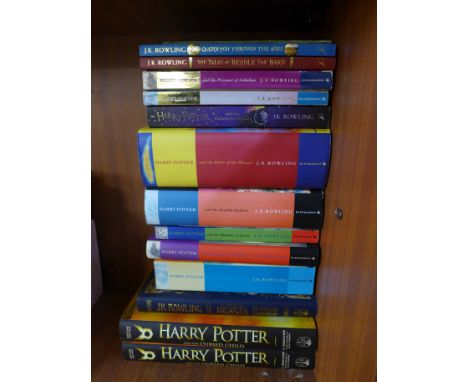 A collection of fourteen Harry Potter and related books, six hardback, two first editions 