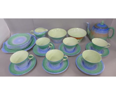 A Shelley dripware six setting tea set comprising six cups and saucers, plate, sugar bowl and milk jug, and two other Shelley