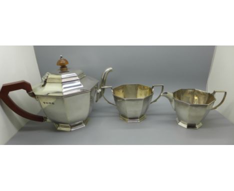A silver three piece tea service, Birmingham 1936, 861g, retailed by Harrods 