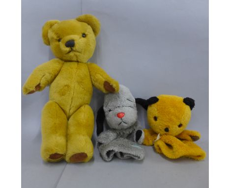 A vintage Merrythought Teddy bear and Sooty and Sweep hand puppets 