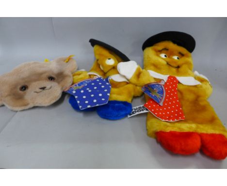 A Steiff Teddy bear handbag and purse and two Merrythought glove puppets 