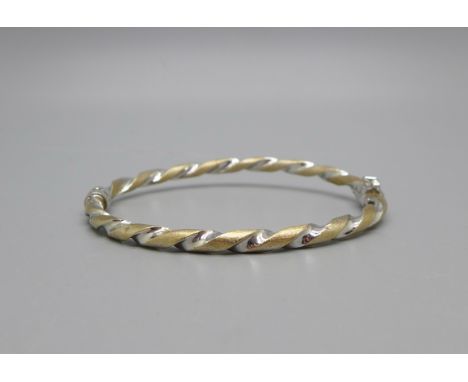 A 9ct gold twist bangle, 5.2g, a/f, gold split 