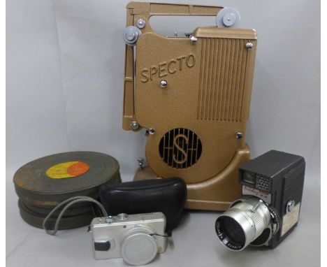 A Specto film projector, a Holiday Metermatic Zoom 8mm camera, three reels of film and a Panasonic DMC-LX2 digital camera 