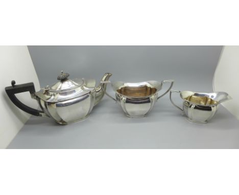 A silver three piece bachelors tea service, Birmingham 1912, 422g 