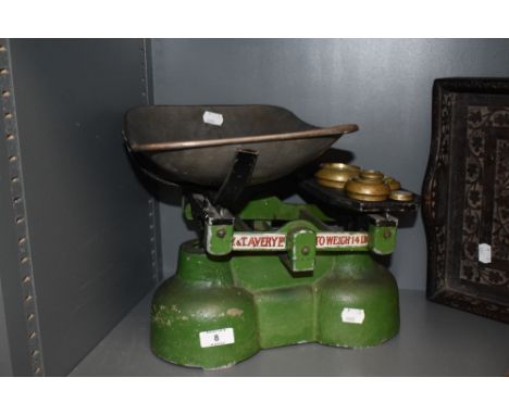 A set of W and T Avery weighing scales with weights.
