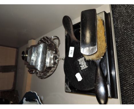 An Edwardian silver mounted ebony dressing table set, to include tray, hand mirror, hair brush and clothes brush. Sold togeth