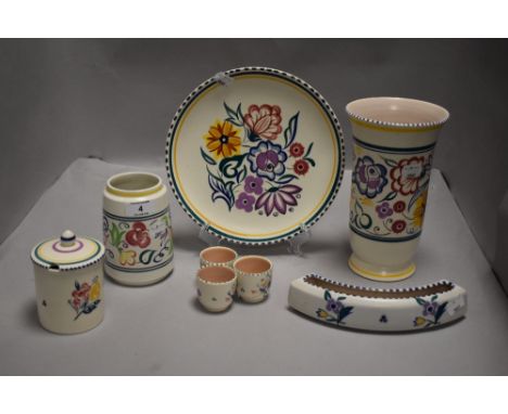 A collection of Poole pottery having floral patterns.