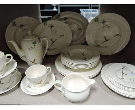 a vintage hunting themed dinner service by Royal Doulton in the Coppice design