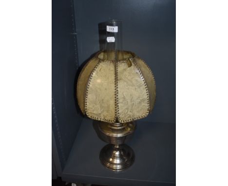An Aladdin Industries Chromed paraffin lamp, the shade comprised of stitched cellulose panels